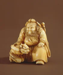 Netsuke en forma de un cazador de demonios y un pequeño demonio, Período Meiji (1868-1912)